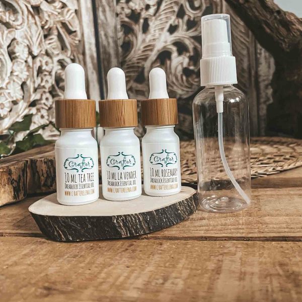 tea tree oil, lavender, rosemary essential oils with spray bottle for dreadlocks