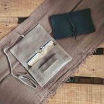 blue and open grey tobacco pouch with tobacco lighter & filters