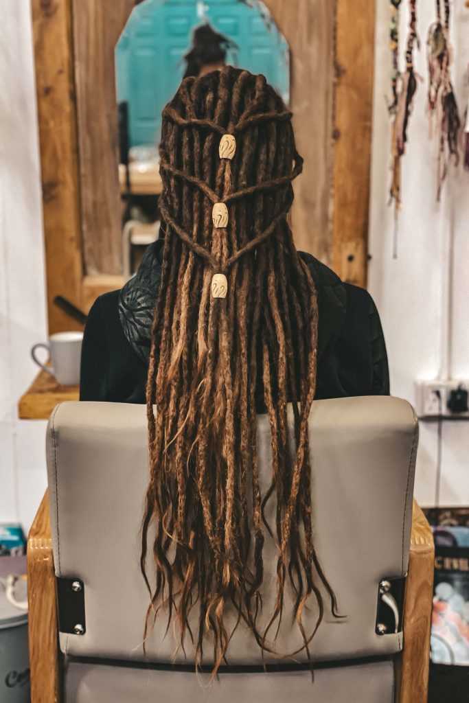 Dreadlock style with Waves Large Wooden Dreadlock Beads style on long brown locs dreadlock accessories