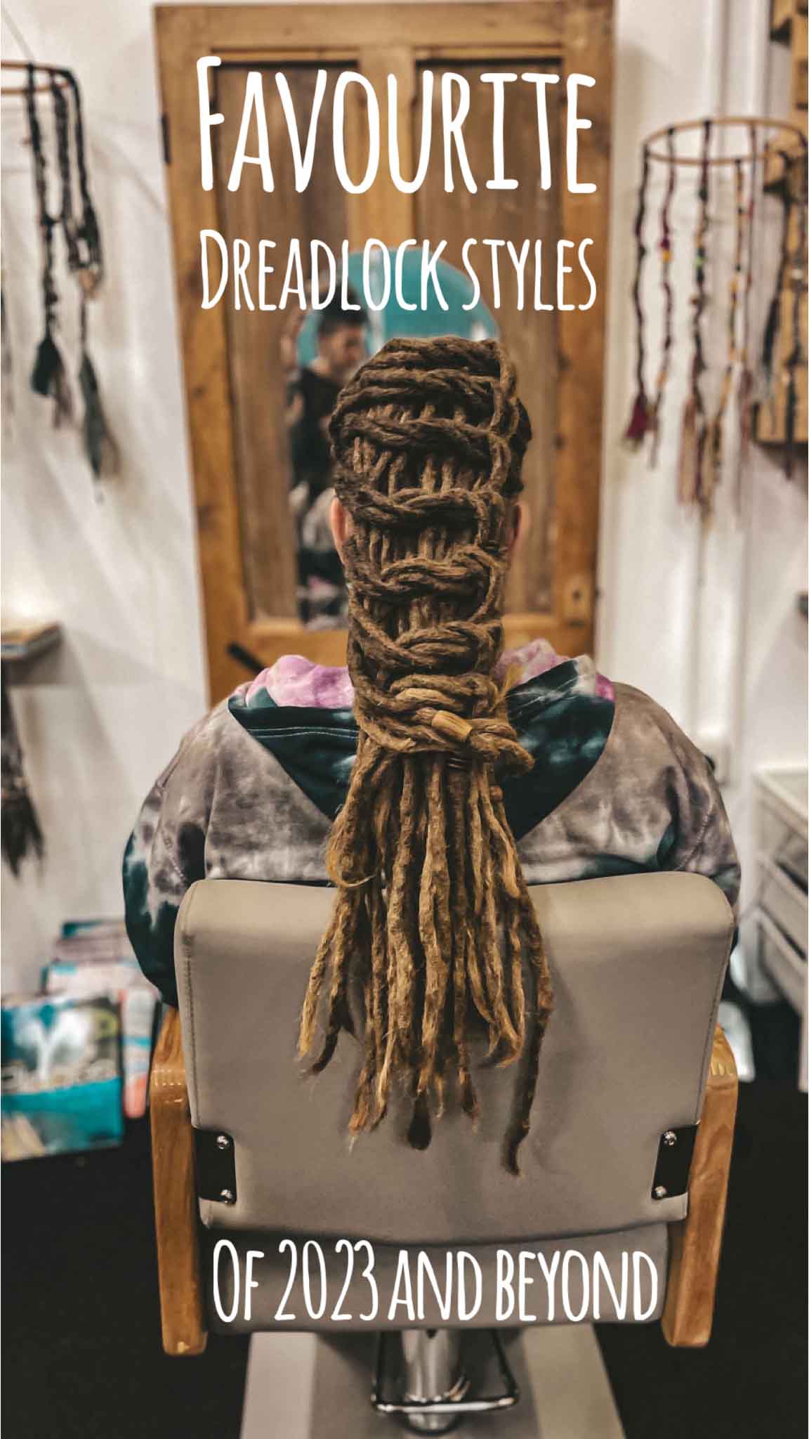 dreadhead sitting on a salon chair with dreadlock style with knots by crafterelena text overlay Favourite dreadlock styles of 2023 and beyond