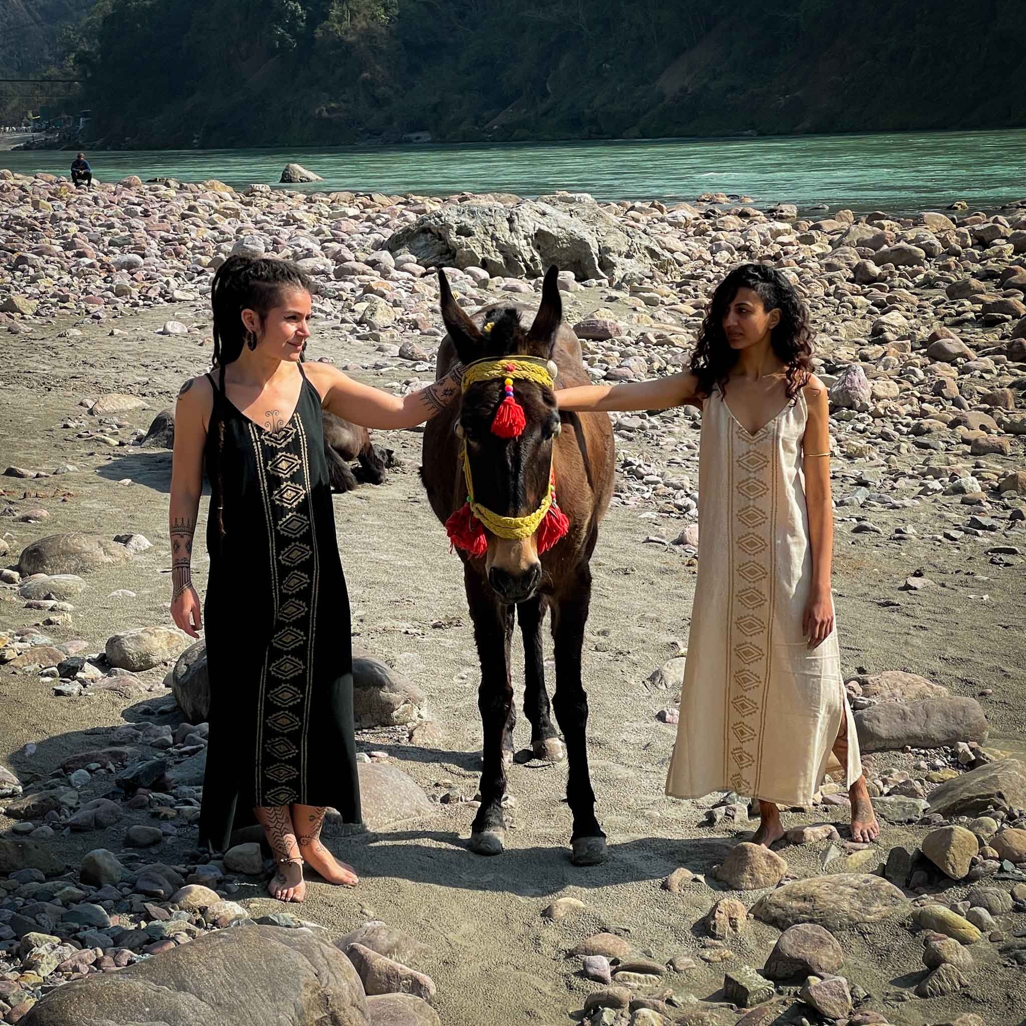 Block Print Maxi Dress Tribal Bohemian Goddess Black Gold, Beige Gold Tribal Pattern girls posing next to Ganga river with a horse CrafterElena clothing collection