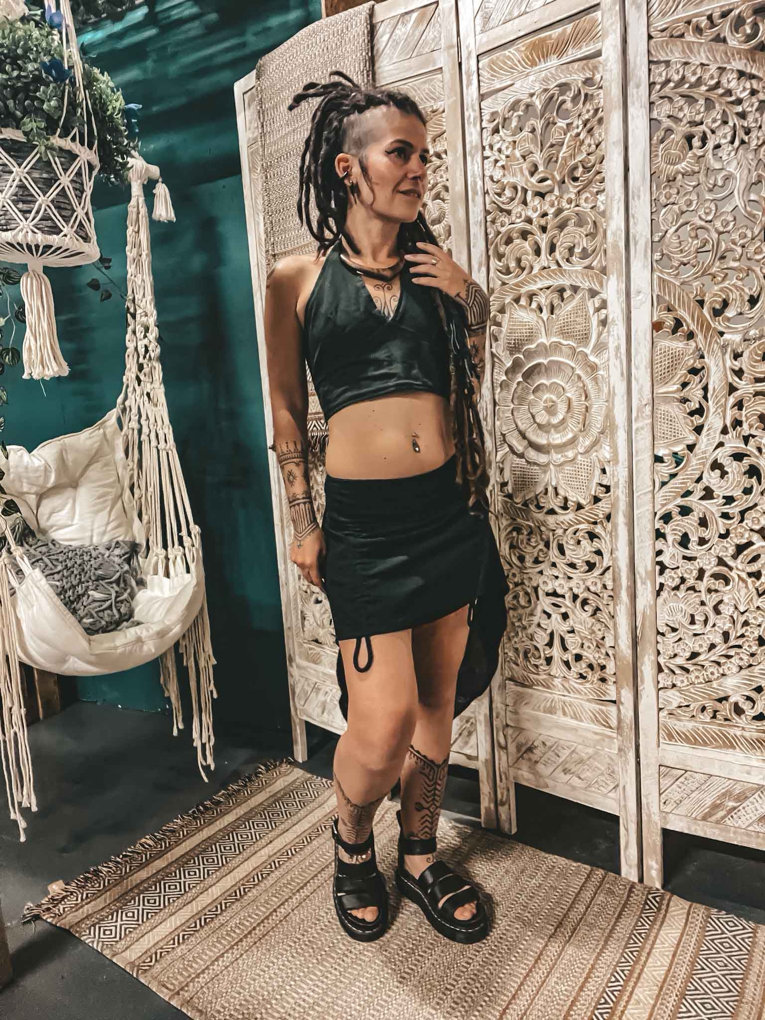 img_7358 Tie Back Crop Top Dark Green and asymmetrical black skirt on bohemian goddess with brass arm bracelet, festival clothing