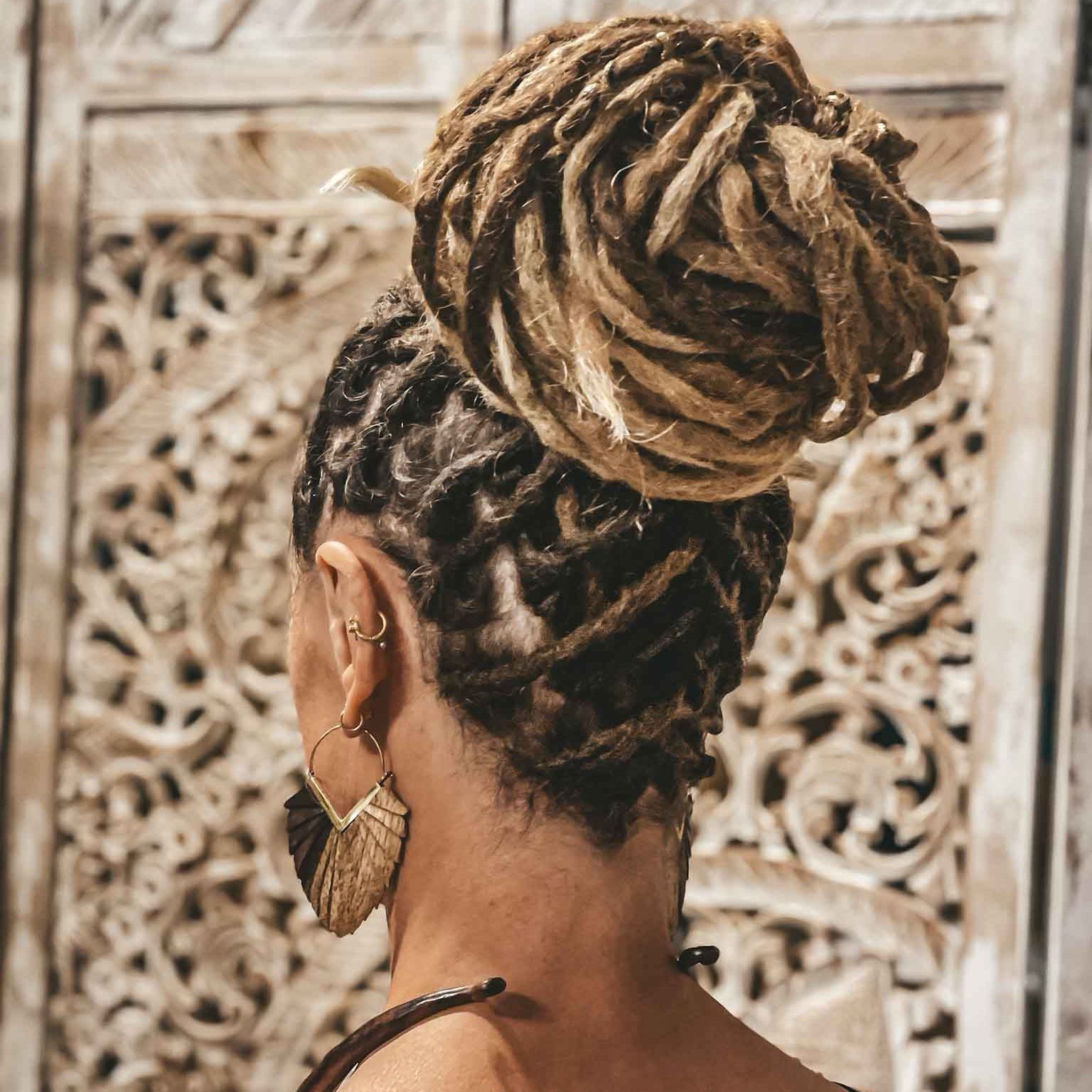 sago wooden earrings doukisa choker on a lady with blonde dreadlocks