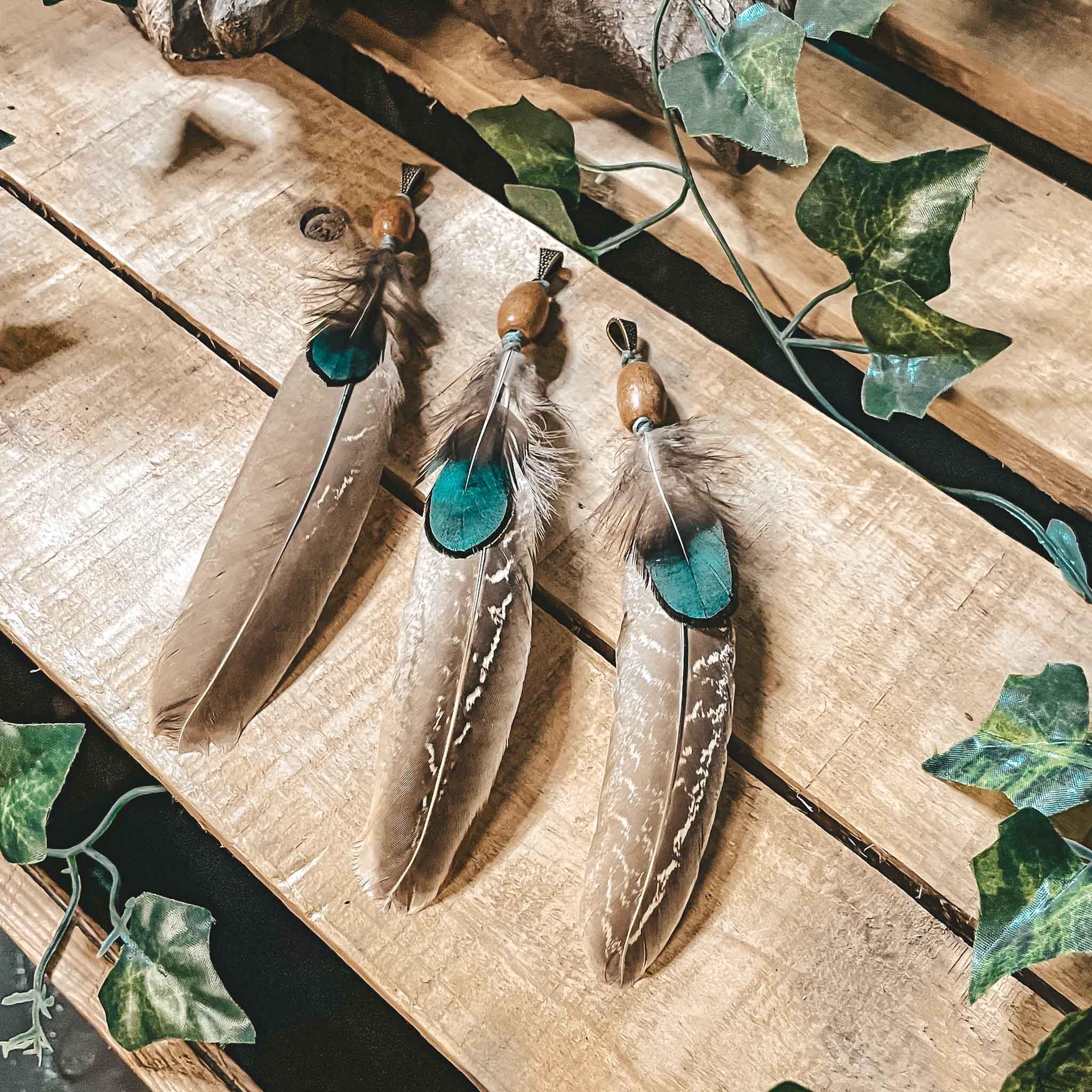 Pheasant feather dreadlock bead hair decoration pheasant feather dreadlock bead hair decoration. Made from natural pheasant feathers, a handmade wooden bead, and finished with antique bronze accent bead,