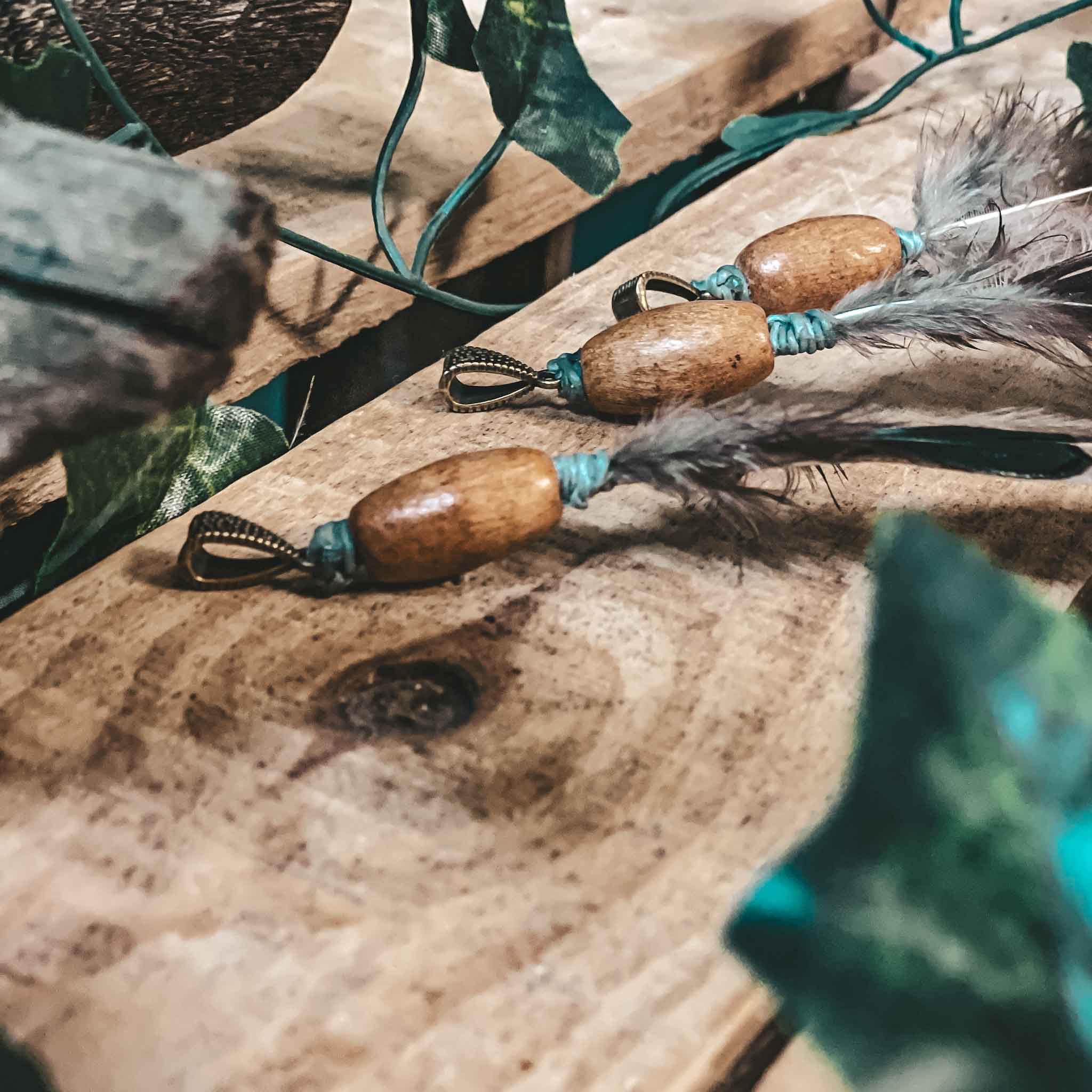 Pheasant feather dreadlock bead hair decoration pheasant feather dreadlock bead hair decoration. Made from natural pheasant feathers, a handmade wooden bead, and finished with antique bronze accent bead,