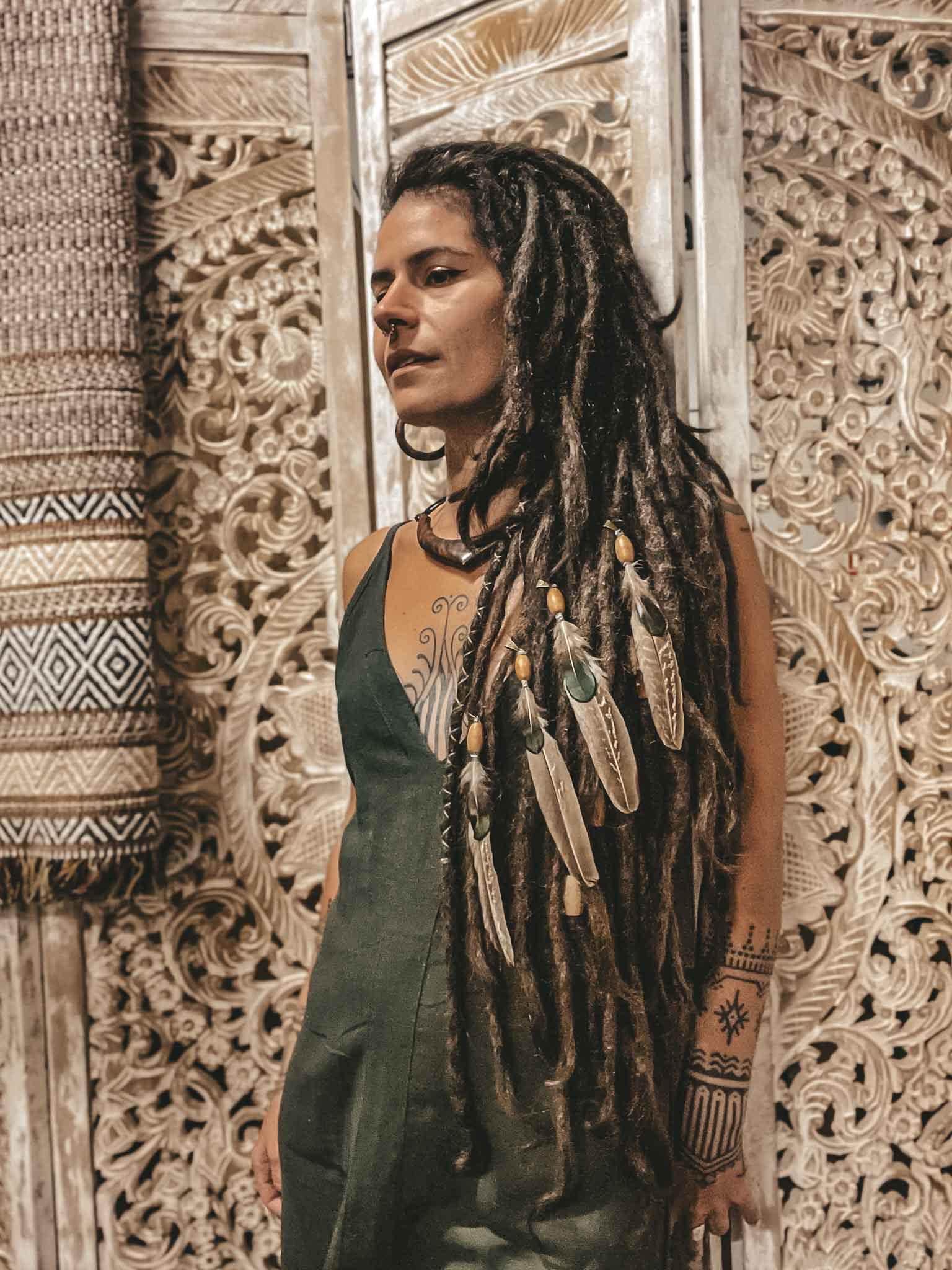 Pheasant feather dreadlock bead hair decoration Pheasant feather dreadlock bead hair decoration on girl with brown dreadlocks