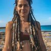 dreadlock girl with hair wraps on the beach CrafterElena