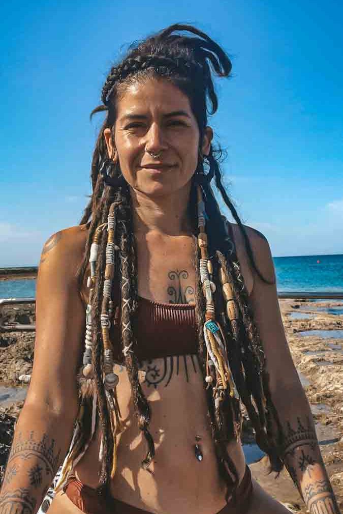 dreadlock girl with hair wraps on the beach CrafterElena