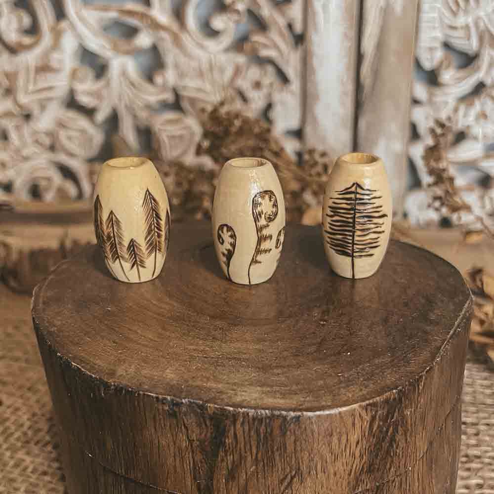 deep forest hand burned design with pyrography technique on 3 large wooden dreadlock beads