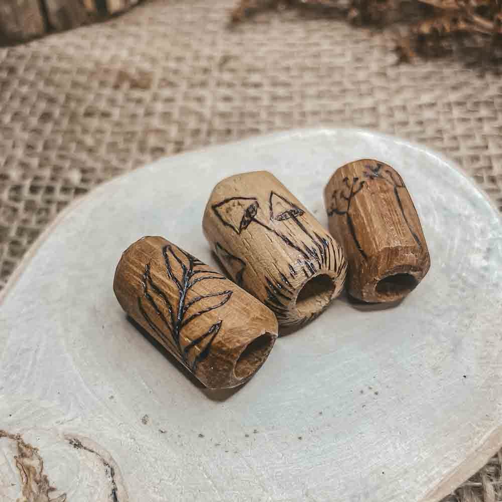 elderflower mushroom leaf pyrography design on iroco wooden dreadlock bead