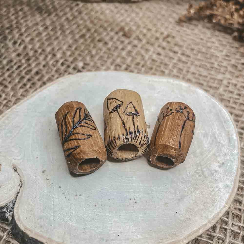 elderflower mushroom leaf pyrography design on iroco wooden dreadlock bead