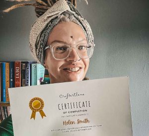 Helen holding her Dreadlock Course Certificate